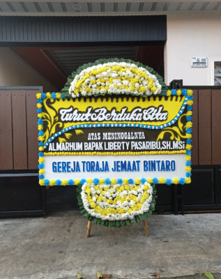 Papan Bunga Duka di Juhar